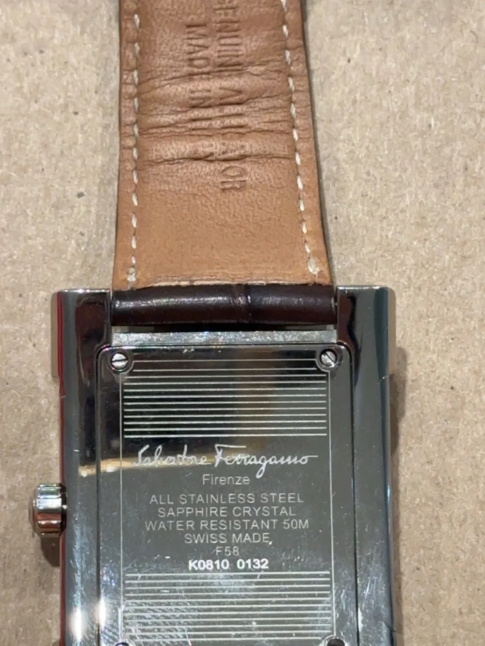 Salvatore Ferragamo Firenze Model K0810 Silver Case with Black Leather Strap.